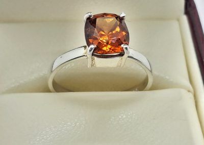 Silver and garnet ring