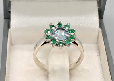 Silver, aquamarine and emerald ring